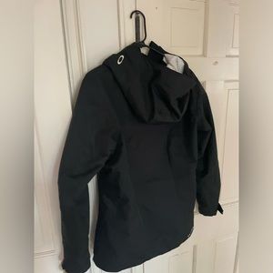 Oakley ski jacket, black, ladies  medium, vented arms, lots of pockets.